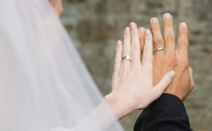 Bride and Groom Looking at Their Rings